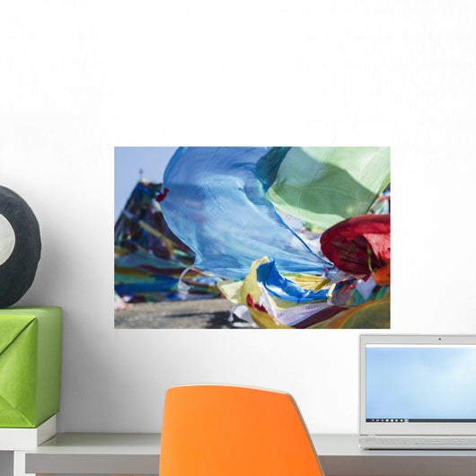 Blessing colourful Tibetan prayer flags under the blue sky Wall Mural