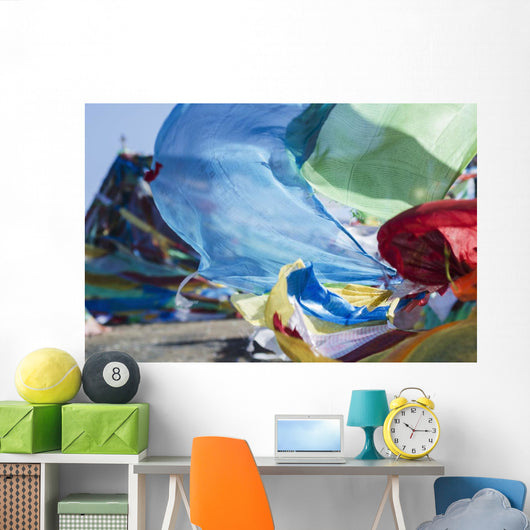Blessing colourful Tibetan prayer flags under the blue sky Wall Mural