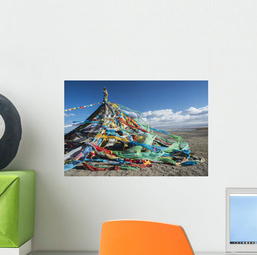Colourful Tibetan prayer flags under the strong wind near Qinghai Lake Wall Mural