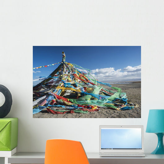 Colourful Tibetan prayer flags under the strong wind near Qinghai Lake Wall Mural