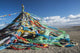 Colourful Tibetan prayer flags under the strong wind near Qinghai Lake Wall Mural