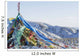 Snowy landscape with prayer flags on a high altitude mountain pass Wall Mural