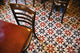 Decorative black and white pattern on the flooring of a restaurant Wall Mural