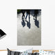 Pedestrians and their shadows on a walkway Wall Mural