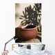 A clay bowl and wooden tool Wall Mural
