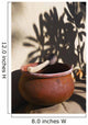 A clay bowl and wooden tool Wall Mural