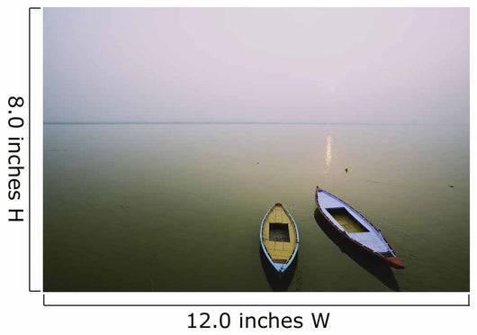 Two wooden boats sit on the tranquil water of the Ganges Wall Mural