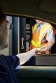 Man Paying Moneyl at Toll Booth Wall Mural