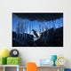 Gentoo Penguin leaping across rocks beneath wall of icicles Wall Mural