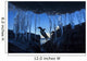 Gentoo Penguin leaping across rocks beneath wall of icicles Wall Mural