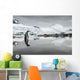 Gentoo Penguin standing in shallow water along glacial coastline Wall Mural