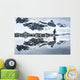 Gentoo Penguin reflected in shallow water along glacial coastline Wall Mural