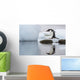 Gentoo Penguin leaps between stones Wall Mural