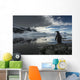 Silhouette of Gentoo Penguin standing on rocky shoreline Wall Mural
