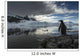 Silhouette of Gentoo Penguin standing on rocky shoreline Wall Mural