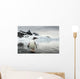 Gentoo Penguin standing in shallow water along glacial coastline Wall Mural