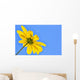 Yellow flower against a blue sky Wall Mural