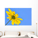 Yellow flower against a blue sky Wall Mural