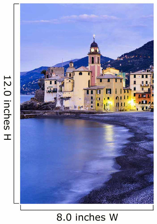 Buildings illuminated by lights along the water's edge at sunrise Wall Mural