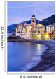 Buildings illuminated by lights along the water's edge at sunrise Wall Mural