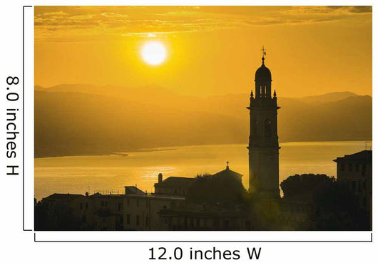 Golden sky at dusk with tower of church Wall Mural