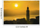 Golden sky at dusk with tower of church Wall Mural