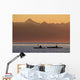 Two female sea kayakers enjoy a warm summer evening while paddling Wall Mural
