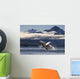 A humpback whale breaches as it leaps Wall Mural