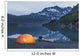 Man reading on a electronic tablet while camping with a tent and kayak Wall Mural