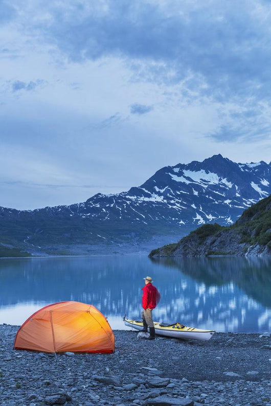 Man camping with a tent and kayak at Shoup Bay State Marine Park Wall Mural
