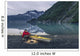 Man reading on a electronic tablet while camping with a kayak Wall Mural