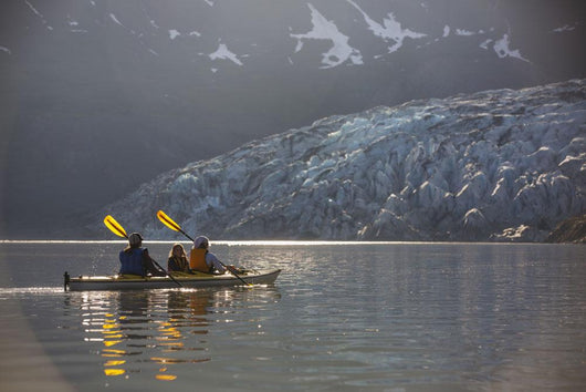 Sea kayakers paddling in evening light at Shoup Bay State Marine Park Wall Mural