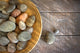 Spa rocks in wooden bowl on rustic wood Wall Mural
