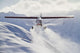 View of a Super Cub air taxi at Tanaina Glacier Wall Mural