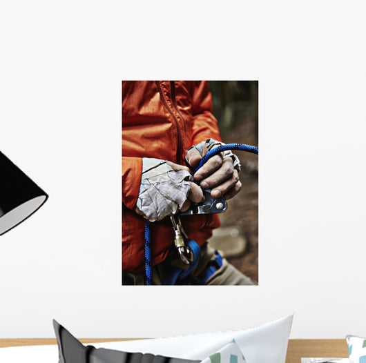 Man adjusting rock climbing equipment in the Adirondacks Wall Mural