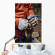 Man adjusting rock climbing equipment in the Adirondacks Wall Mural