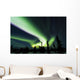 The bright neon green aurora swirling above the boreal forest Wall Mural