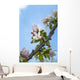 Pink and white crabapple flowers against a blue sky Wall Mural