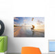 Kiteboarding in tropical lagoon in the South Pacific at sunset Wall Mural