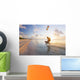 Kiteboarding in tropical lagoon in the South Pacific at sunset Wall Mural