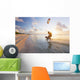 Kiteboarding in tropical lagoon in the South Pacific at sunset Wall Mural