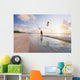 Kiteboarding in tropical lagoon in the South Pacific at sunset Wall Mural
