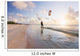 Kiteboarding in tropical lagoon in the South Pacific at sunset Wall Mural