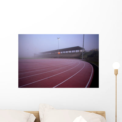 Foggy Running Track Wall Mural shown on a wall