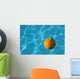 Yellow Waterpolo Ball in Blue Pool Wall Mural