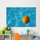 Yellow Waterpolo Ball in Blue Pool Wall Mural