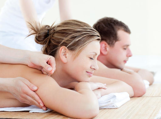 Loving couple having an acupunctre therapy Wall Mural