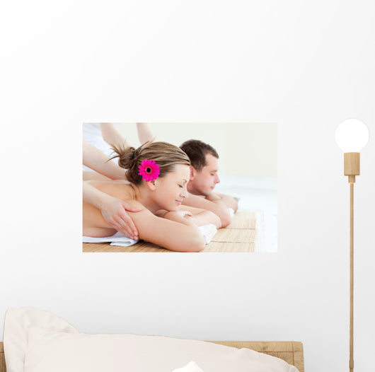 Relaxed couple having a back massage Wall Mural