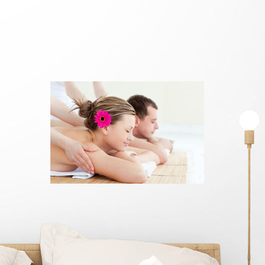 Relaxed couple having a back massage Wall Mural