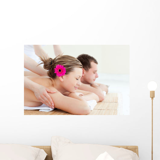 Relaxed couple having a back massage Wall Mural